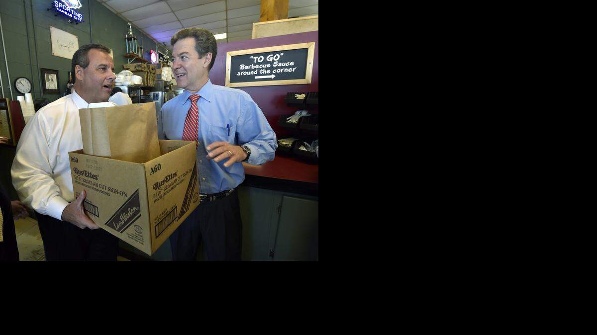 
New Jersey Gov. Chris Christie and Kansas Gov. Sam Brownback picked up an order to go during Wednesday’s visit to Oklahoma Joe’s BBQ, 3002 W. 47th St. in Kansas City, Kan. Christie was in town to campaign for Brownback.
