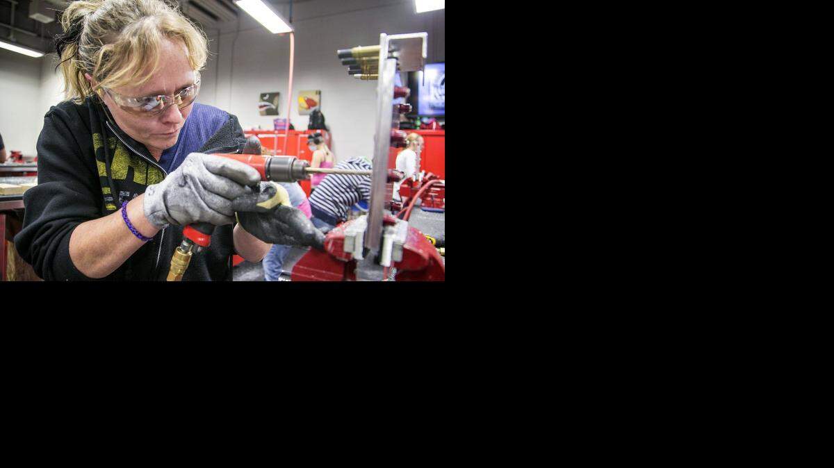 
Sheet metal student Cindy Claiborne is one of the Wichita Area Technical College students being trained for jobs at Spirit AeroSystems. Their training is being paid for by a grant from the state and is similar to the type of job training programs that could happen locally if the sales tax passes. When the students graduate at the end of this month, after two months of training, they will have entry-level jobs waiting for them at Spirit. 
