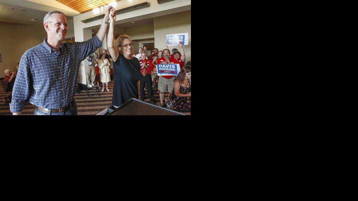 
Democratic gubernatorial candidate Paul Davis and his running mate, Jill Docking, acknowledge their supporters Saturday after his speech at Demofest. (Aug. 23, 2014)
