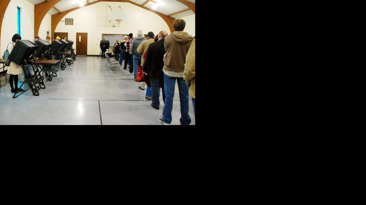 
People wait in line to vote at St. Andrew’s Lutheran Church Tuesday morning.
