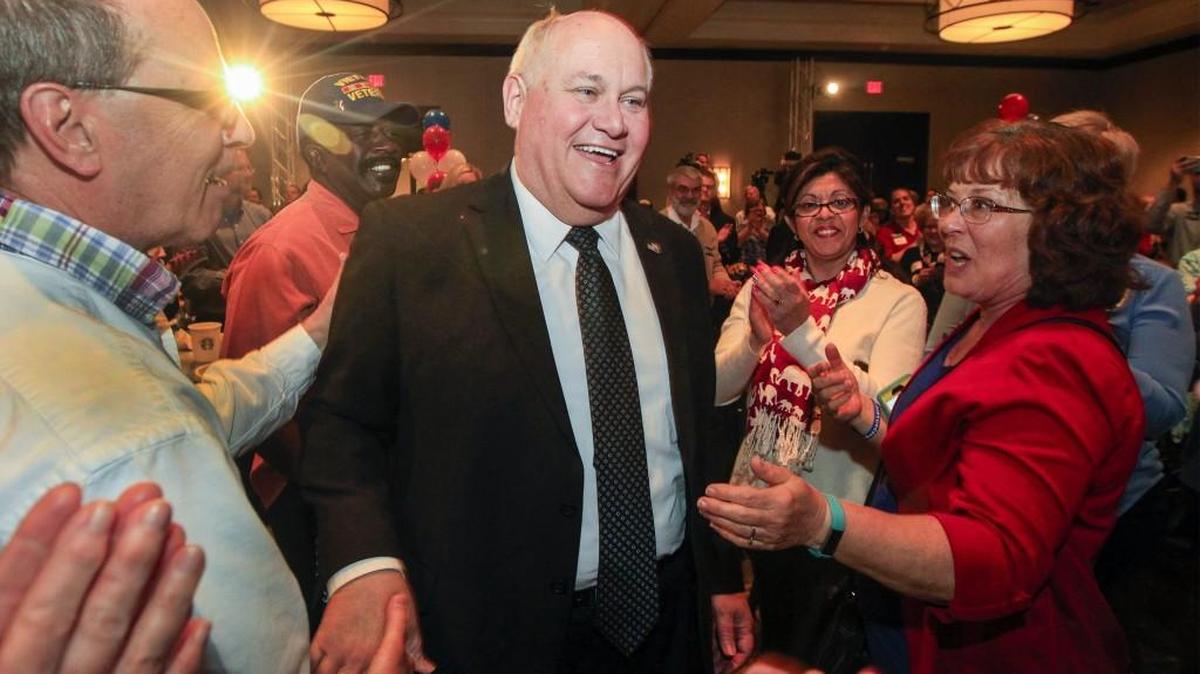Ron Estes receives congratulations Tuesday night after being named the winner of the 4th District congressional race during his watch party at the Marriott. (April 11, 2017)