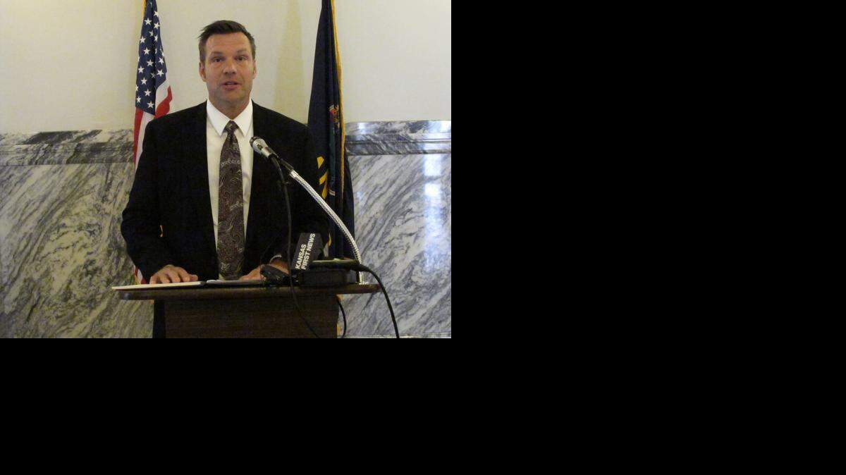 
Kansas Secretary of State Kris Kobach on Thursday discusses a state Supreme Court ruling requiring him to remove the Democratic nominee for the U.S. Senate from the ballot. Democrat Chad Taylor wanted to withdraw, but Kobach had blocked the move. (AP Photo/John Hanna)
