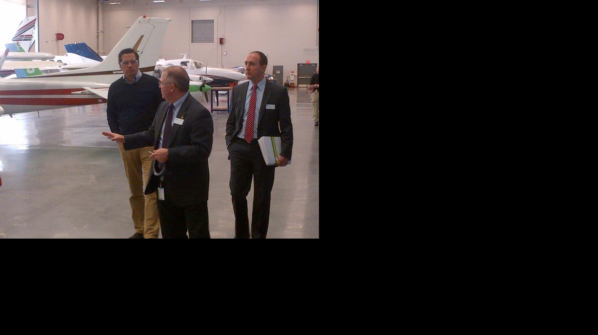 
Senate candidate Greg Orman, left, tours a hangar with Wichita Area Technical College officials Randy Roebuck, center, and Joe Ontijes.
