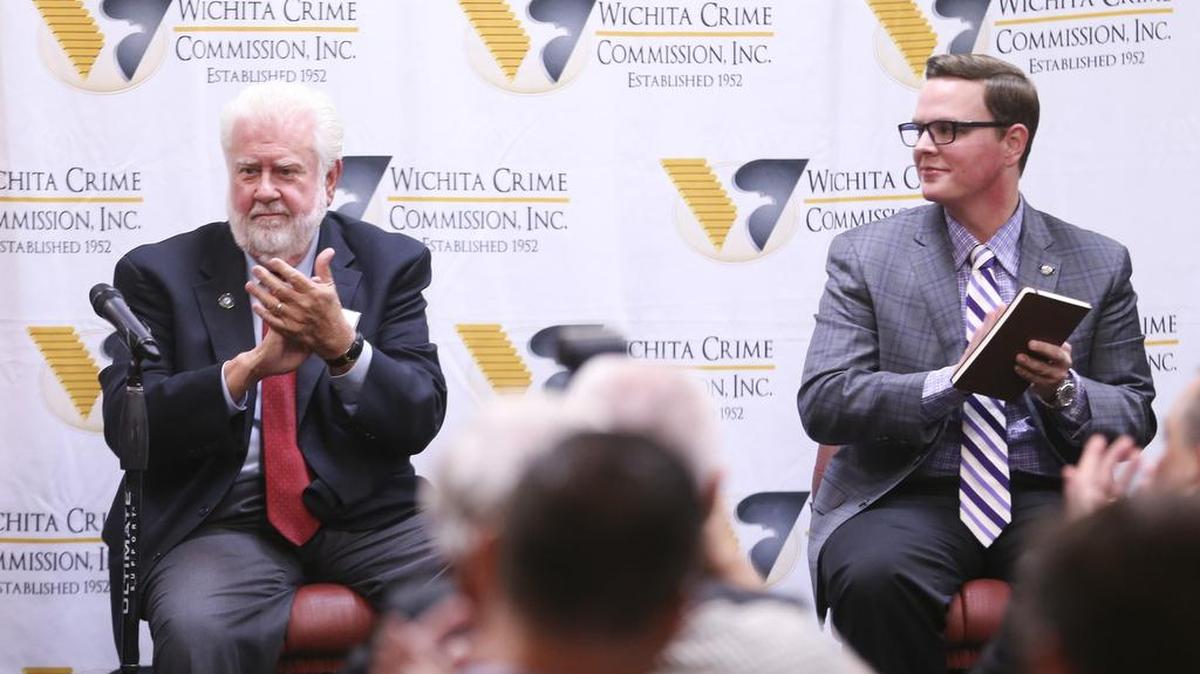 County Commissioner Tim Norton, left, and his opponent, Michael O’Donnell, wrap up their debate before members of the Wichita Crime Commission in September at Scotch and Sirloin.