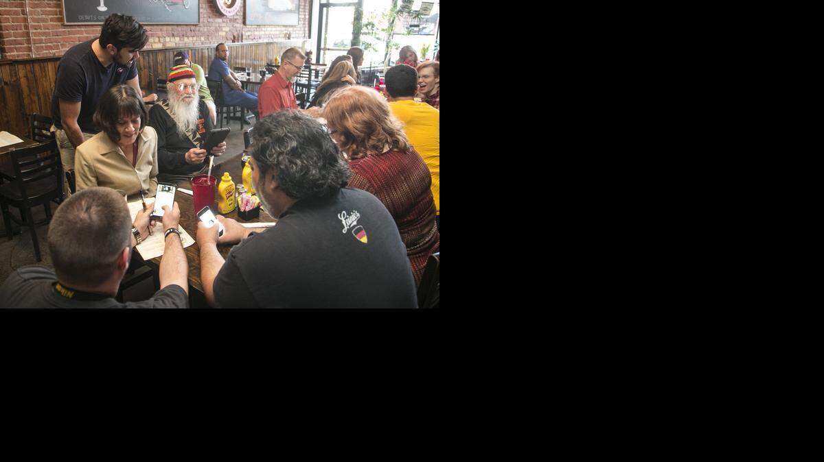 
Supporters of the local marijuana initiative ballot question watch returns at the Anchor on Tuesday evening. (April 7, 2015)
