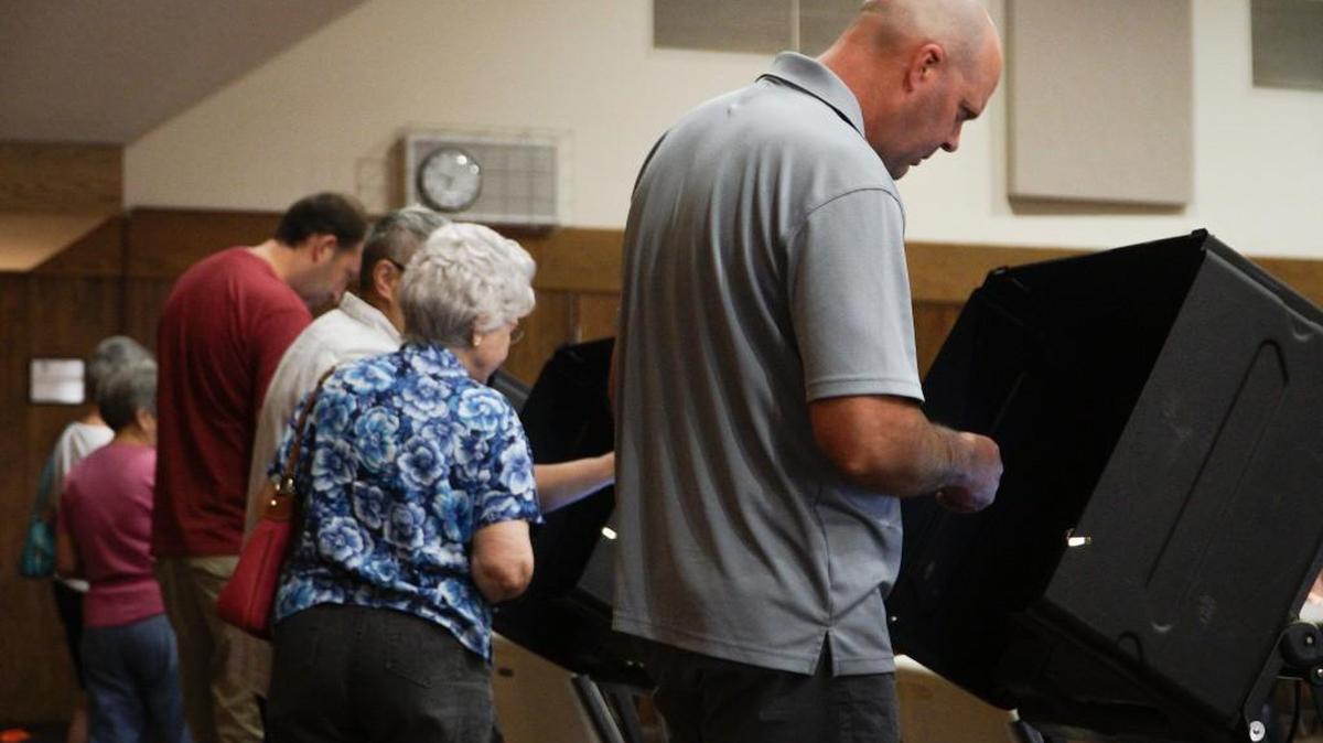 Kevin Hackerott casts his vote in the primary election at St. Elizabeth Ann Seton Catholic Church at 645 N. 119th St West.