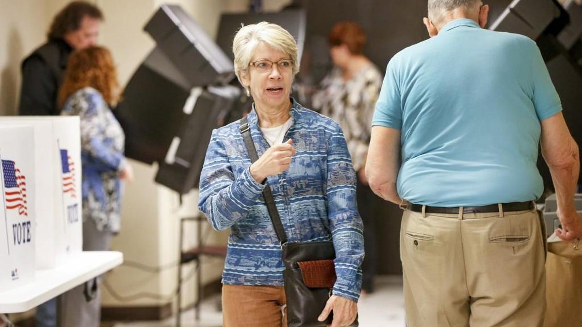 Rose Bundy, center, leaves the election office at the Historic Sedgwick County Courthouse after voting last week. (April 5, 2017)