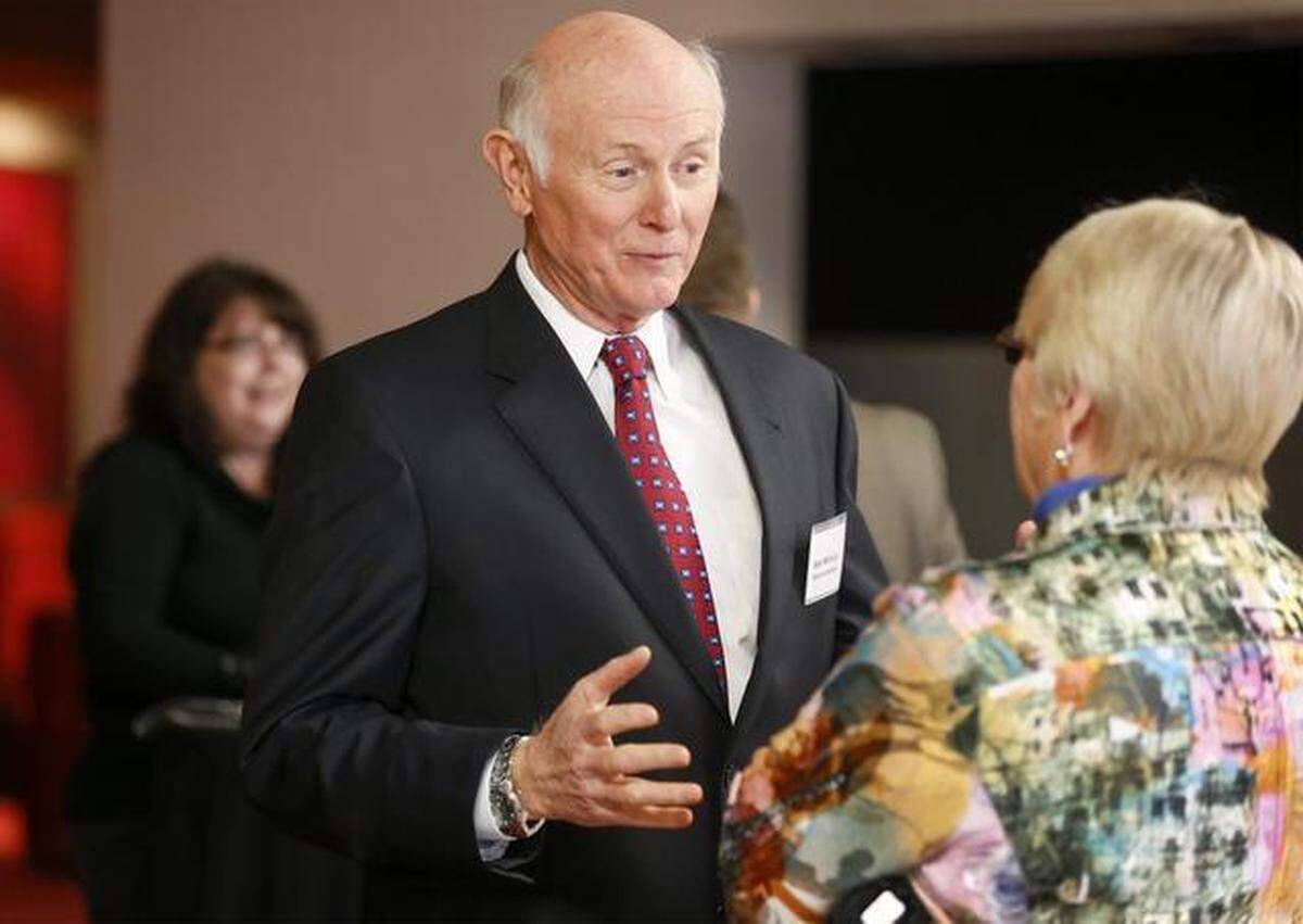 Mayoral candidate Sam Williams talks with citizens before an Arts Council forum Thursday at the Mary Jane Teall Theater in Century II. (March 19, 2015)