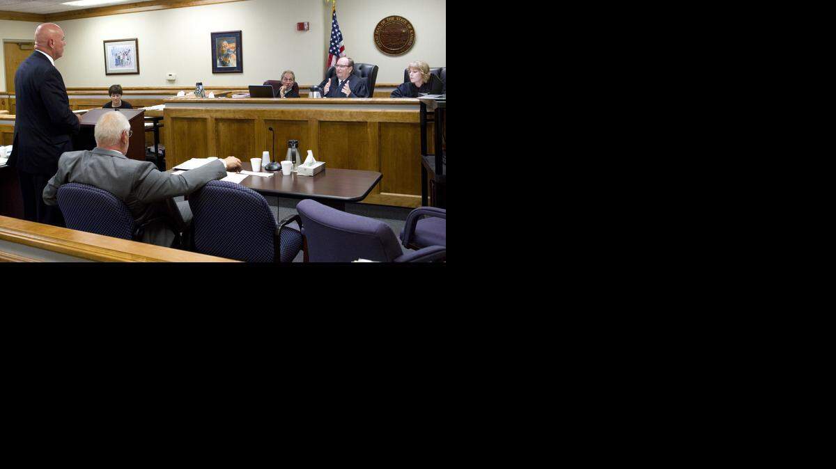 
Attorney Randy Rathbun, standing, listens as Shawnee County District Court Judge Larry Hendricks, second from right, poses a question during proceedings Monday in Shawnee County District Court in Topeka. Attorney Tom Haney, second from left, was representing David Orel, a Democrat who sued the Democratic Party, seeking to force it to list a candidate after Shawnee County District Attorney Chad Taylor won the Democratic primary, then withdrew from the race. Rathbun defended the Democratic Party and three party officials.
