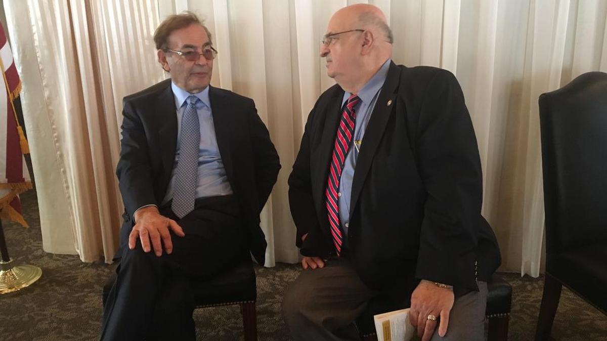 Phil Ruffin, left, chats with John Stevens, president of the Wichita Pachyderm Club, before Friday’s luncheon.