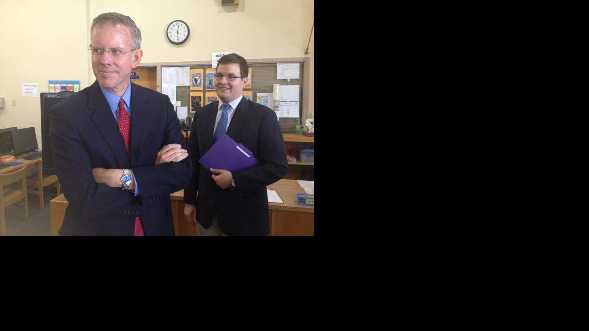 
Paul Davis, Democratic nominee for governor, joined by aide Chris Pumpelly, right, at campaign event at Lowman Hill Elementary in Topeka.
