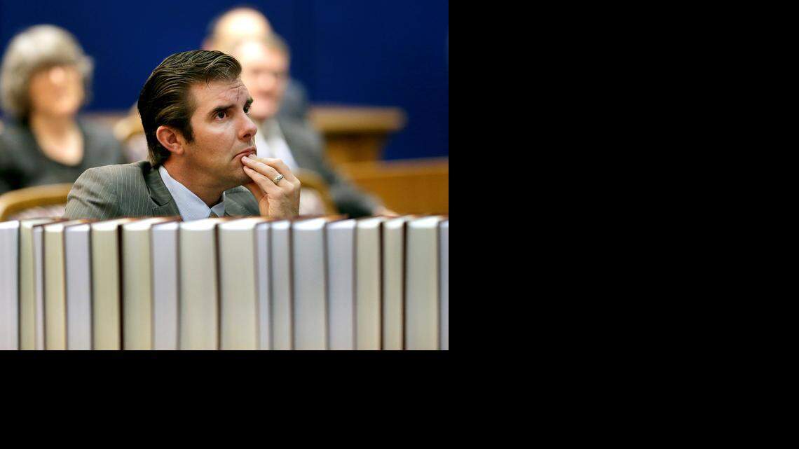 
Democrat Chad Taylor listens to arguments before the Kansas Supreme Court in his petition to remove his name from the ballot after he withdrew from the U.S. Senate race Tuesday, Sept. 16, 2014, in Topeka. Taylor's attempt to remove his name from the ballot has been disputed by Kansas Secretary of State Kris Kobach, a Republican, who backs incumbent Sen. Pat Roberts. 
