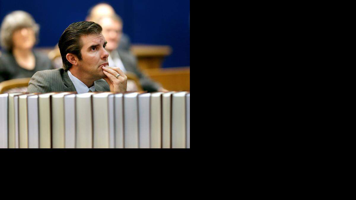 
Democrat Chad Taylor listens to arguments before the Kansas Supreme Court in his petition to remove his name from the ballot after he withdrew from the U.S. Senate race Tuesday, Sept. 16, 2014, in Topeka. Taylor's attempt to remove his name from the ballot has been disputed by Kansas Secretary of State Kris Kobach, a Republican, who backs incumbent Sen. Pat Roberts. 
