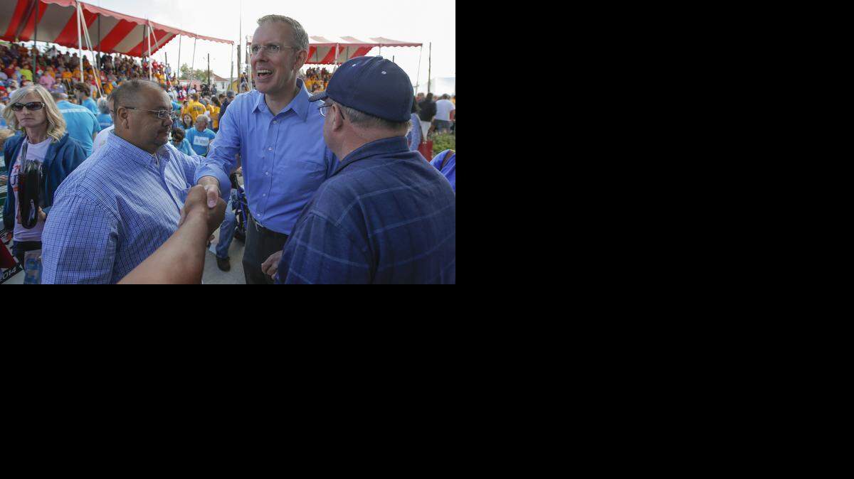
Paul Davis shakes hands with supporters after his debate with Sam Brownback on Saturday at the Kansas State Fair in Hutchinson. 
