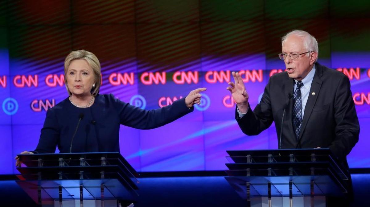 Democratic presidential candidates Hillary Clinton, left, and Sen. Bernie Sanders, I-Vt., argue a point during a debate Sunday in Flint, Mich.