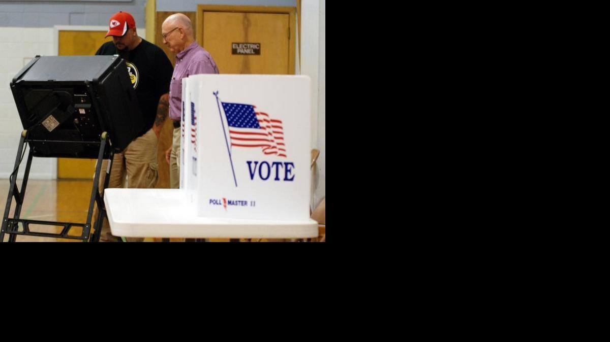 
A poll worker helps a voter at Olivet Baptist Church during the Aug. 5 primary.
