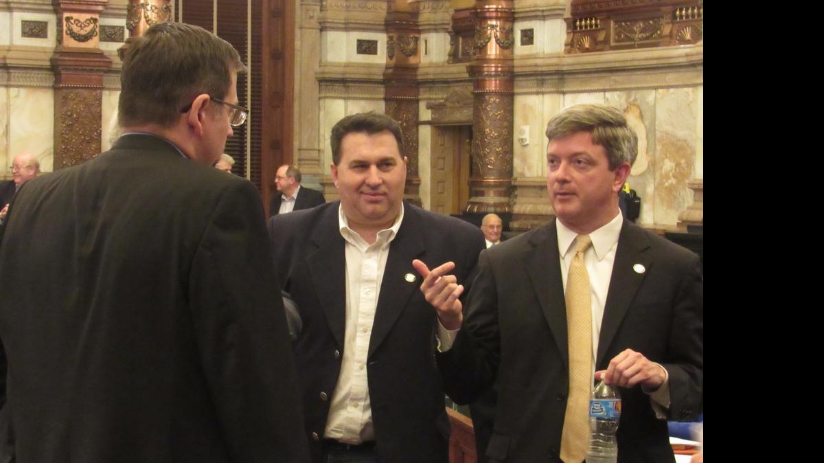 
Senate Vice President Jeff King, right, R-Independence, confers Sunday with Sen. Rob Olson, center, R-Olathe, and Senate Majority Leader Terry Bruce, R-Hutchinson, as a tax debate goes beyond midnight. 
