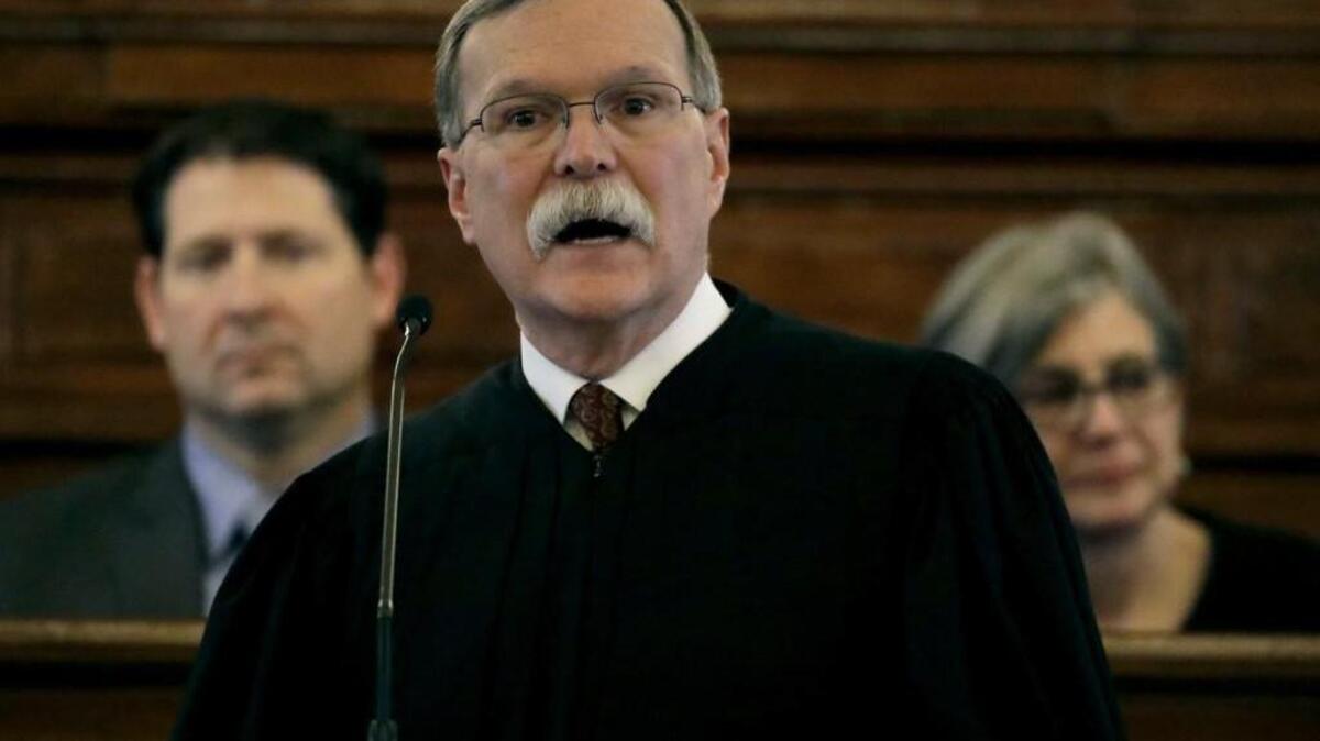 Kansas Supreme Court Chief Justice Lawton Nuss addresses Kansas lawmakers on Wednesday during the annual State of the Judiciary address, attended by Senate President Susan Wagle and House Speaker Ron Ryckman at the Statehouse. (March 15, 2017)