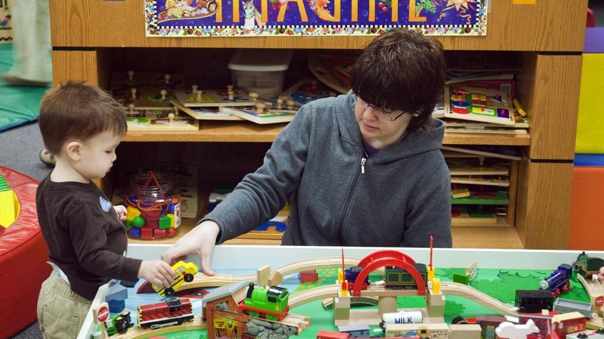 Shaunda Chang and son Joey play during a Parents as Teachers program at Adams Elementary in 2011. Kansas uses money from a settlement with tobacco companies to fund children’s programs, such as Early Head Start and Parents as Teachers. Last year’s payment was more than $62 million.