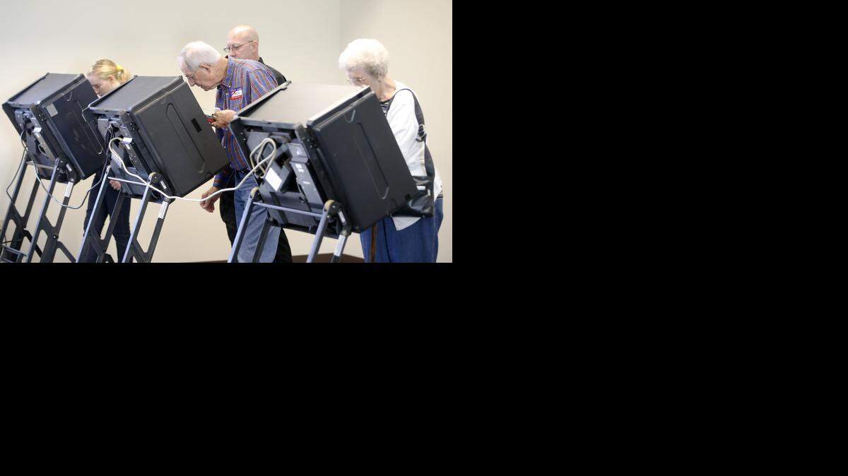 
Voters cast their ballots during advance voting at Grace Presbyterian Church in October.
