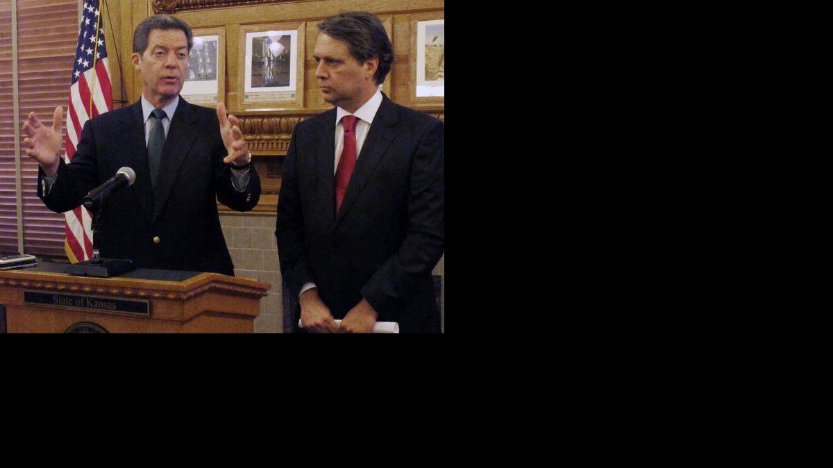 
Kansas Gov. Sam Brownback, left, and Lt. Gov. Jeff Colyer at the Statehouse in Topeka. (Sept. 11, 2014)
