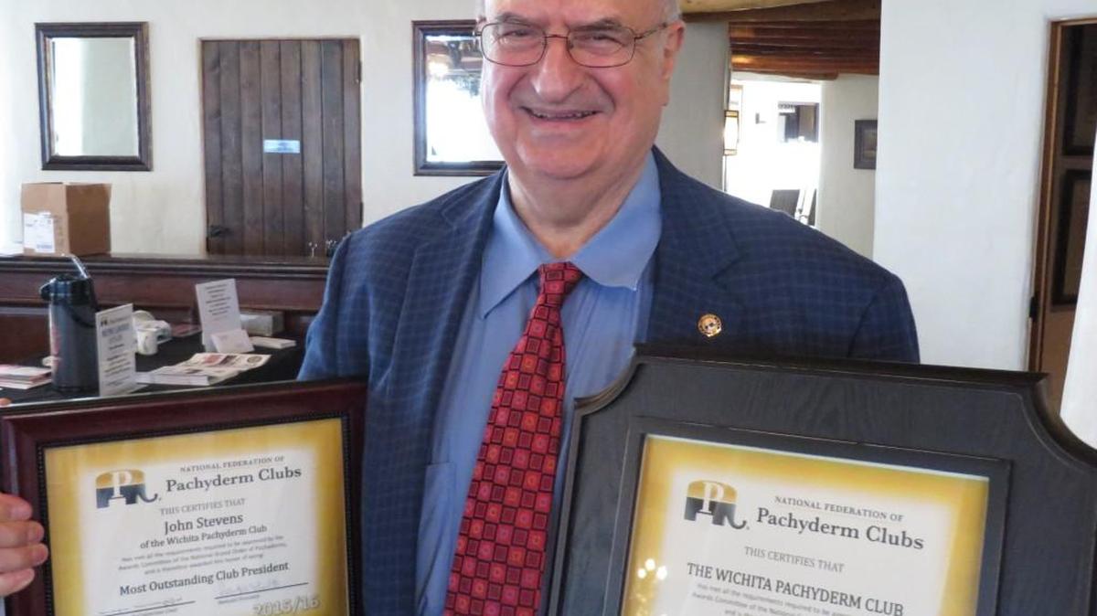 Wichita Pachyderm Club President John Stevens holds the award the Republican club won last week for most outstanding club in the nation, and his own award for most outstanding club president.