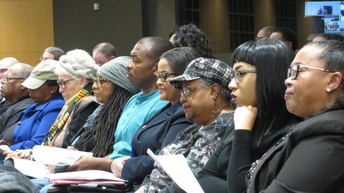 Supporters of the Dunbar Theatre restoration project listen to City Council deliberations Tuesday leading up to an approximately $660,000 grant to the project.