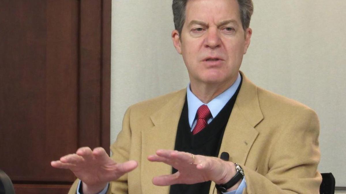 Gov. Sam Brownback announces a new mentoring program for welfare recipients in January. The Kansas Department for Children and Families is looking for ways to increase participation in the program.