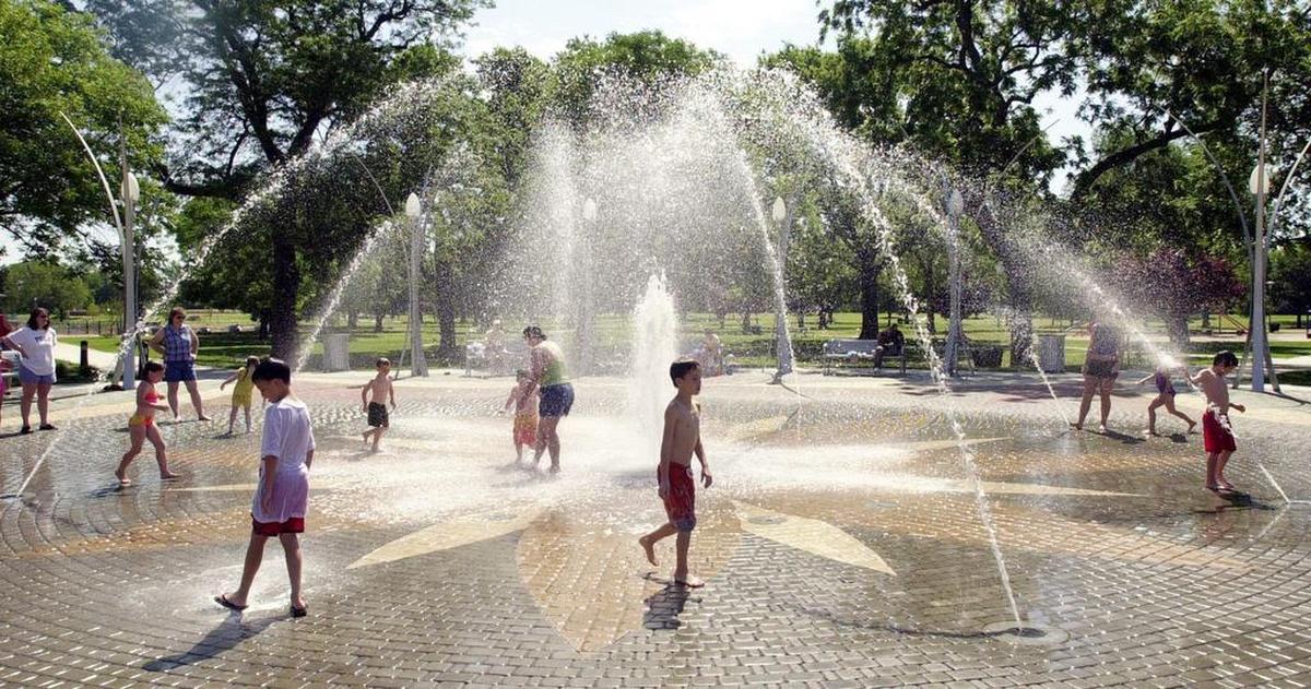 Children play in the fountains at Central Riverside Park.