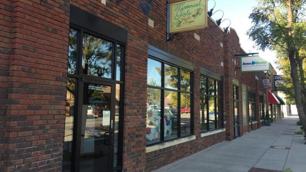 A street in the Delano neighborhood is seen in August. Under a new bill being proposed, people would be allowed to carry around alcoholic beverages in certain outdoor areas.