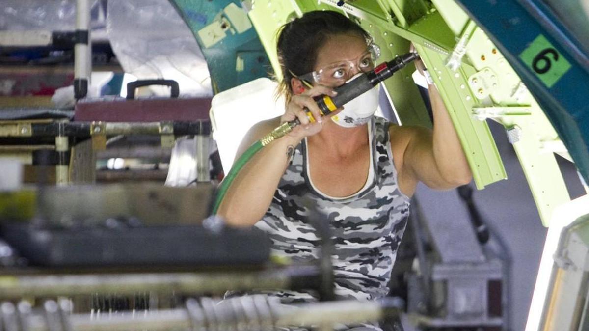 FILE -- A Spirit AeroSystems employee works on a Boeing 737 fuselage.