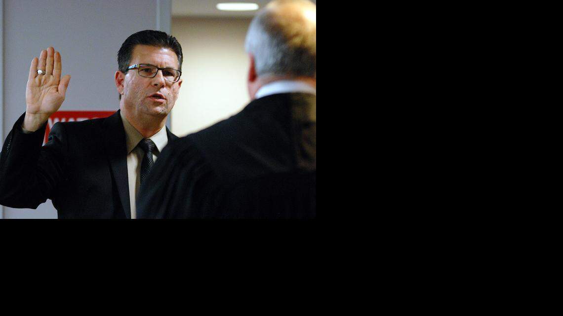 
Jim Howell is sworn in Sunday as a new commissioner on the Sedgwick County Commission by Judge Eric Yost.
