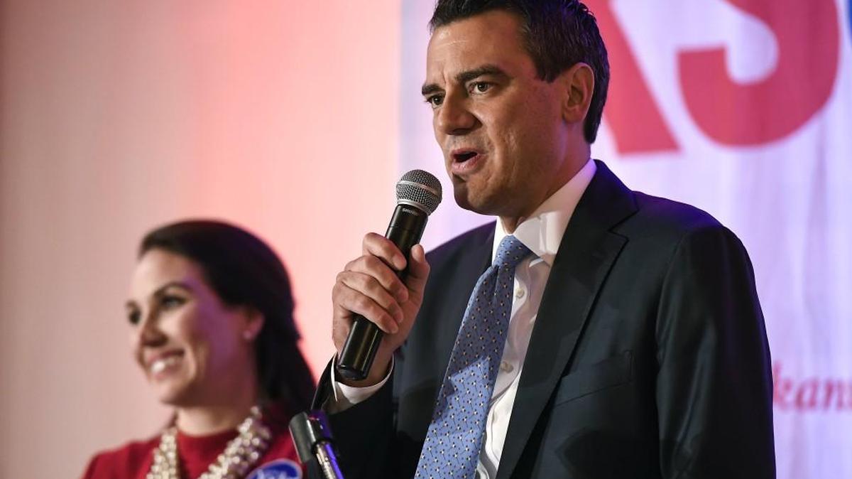 Kevin Yoder, with his wife, Brooke, speaks to supporters on Election Night at the Overland Park Marriott.