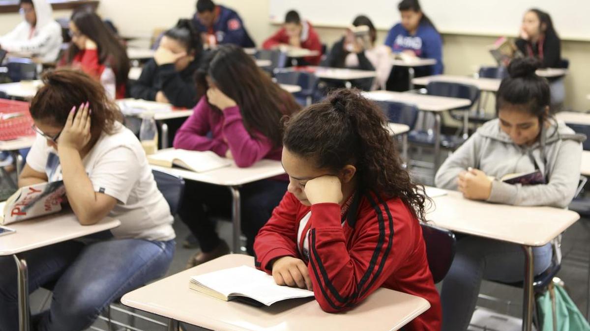 North High freshman Alejandra Hernandez reads during “Tower Time,” a time where the entire schools spends half the period reading.