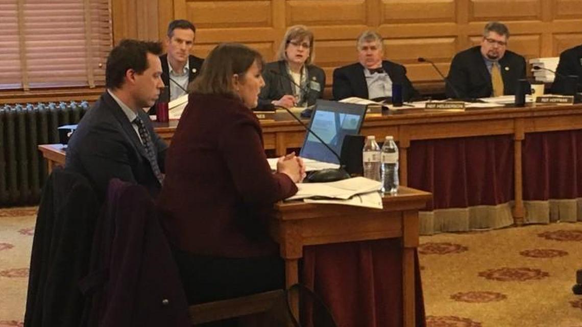 Lori Taylor, right, and her colleague, Jason Willis, speak with lawmakers on Friday. Taylor is helping develop school funding recommendations for the Legislature. She has faced criticism from a Texas judge over her past work.