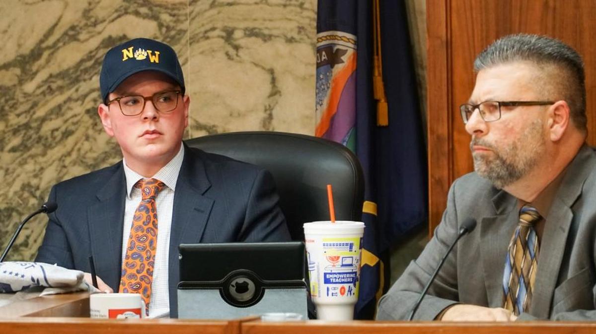 Sedgwick County Commissioner Michael O'Donnell, left, wears a Northwest High School hat after settling a bet with Commissioner David Dennis. Northwest High School is in Dennis' district and Campus High School is in O'Donnell's. The two teams met in the playoffs last week. Northwest won, and that is why O'Donnell wore the Northwest hat. At right is Commissioner Jim Howell. (November 8, 2017)