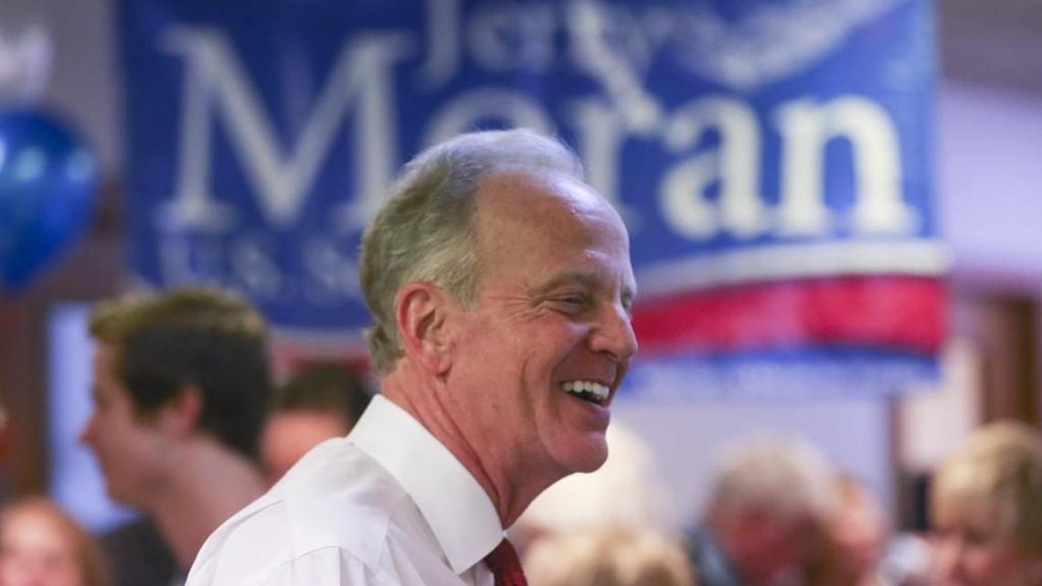 Senator Jerry Moran celebrates with supporters at the opening of his campaign office in Wichita in May.