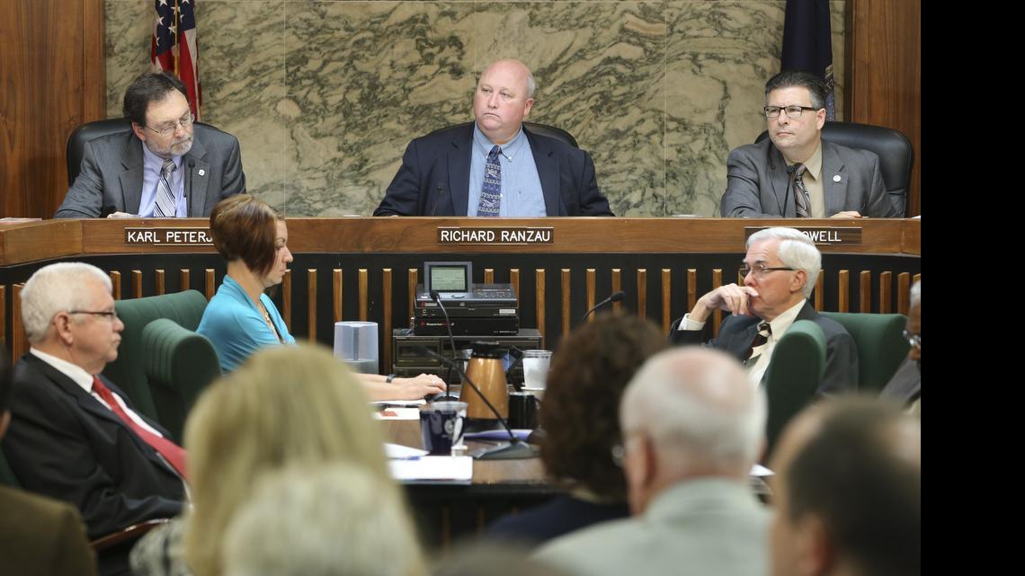 
From left, Sedgwick County Commissioners Karl Peterjohn, Richard Ranzau and Jim Howell listen to public comments on the budget on Wednesday. 
