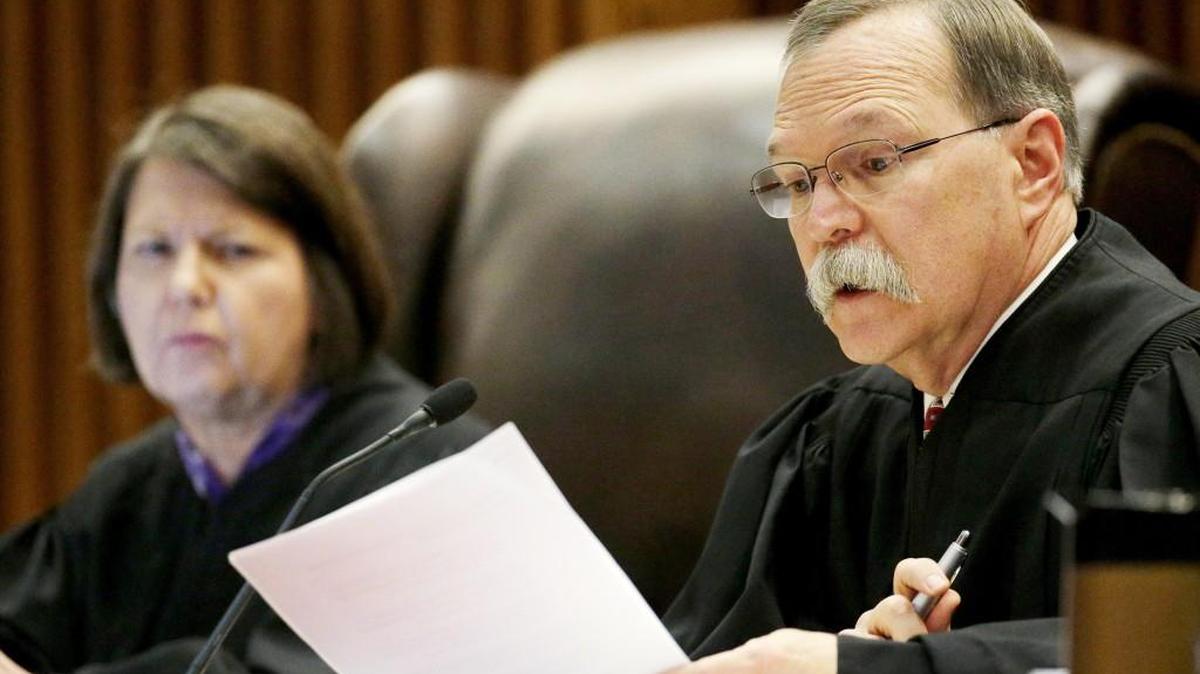 Kansas Supreme Court Justice Marla Luckert, left, listens while Chief Justice Lawton Nuss asks a question during oral arguments in Gannon v. State of Kansas at the Kansas Supreme Court in November. The case, filed on behalf of several school districts, contends current school funding isn’t equitable or adequate.