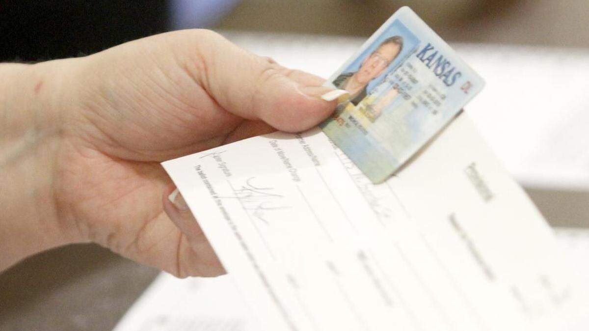 Although a federal judge struck down a proof-of-citizenship requirement for registration, voters still have to show an ID at the polls.