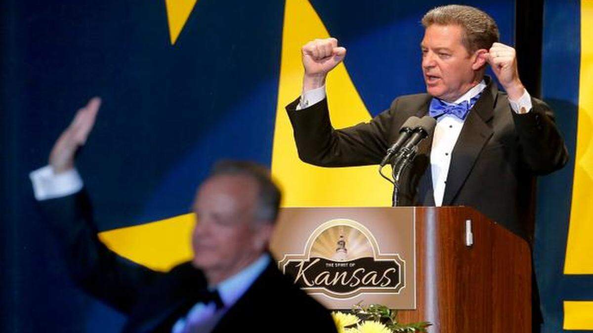 
Gov. Sam Brownback, right, recognizes U.S. Sen. Jerry Moran during Saturday night’s inaugural ball at the Kansas Expocentre.
