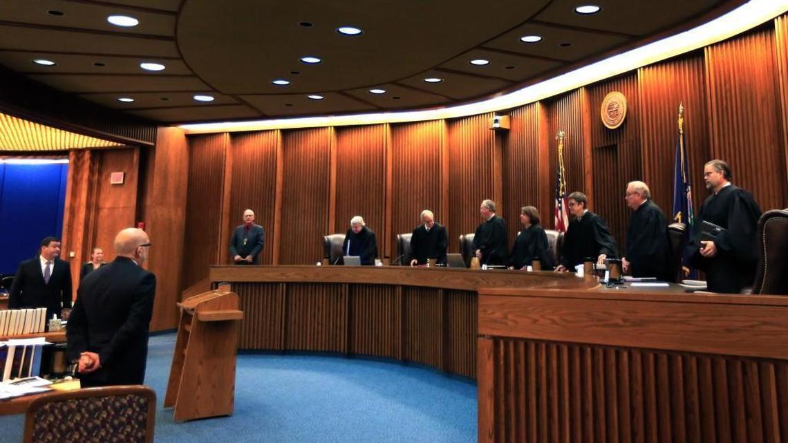 Justices take their seats to hear oral arguments in a judicial funding case before the Kansas Supreme Court on Dec. 10 in Topeka. The high court heard arguments Thursday about a 2014 law that strips it of its authority to appoint the chief judges in the state's 31 judicial districts and gives it to local judges.