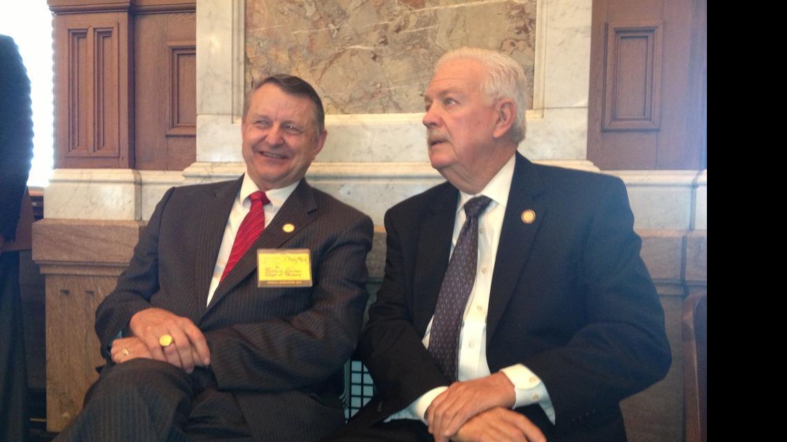 
House Speaker Ray Merrick, R-Stilwell, speaks with Richard Carlson, legislative liaison for the Kansas Department of Revenue, during Friday's tax debate.
