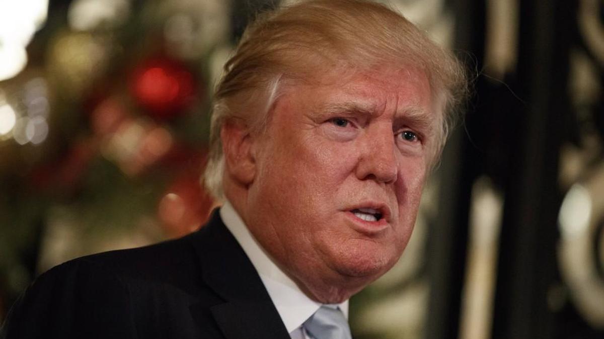 President-elect Trump speaks to reporters on Dec. 28 in Palm Beach, Fla. Unverified reports have surfaced that Russia has compromising information on Trump’s personal life and business interests, claims on which Trump and President Obama have both been briefed.