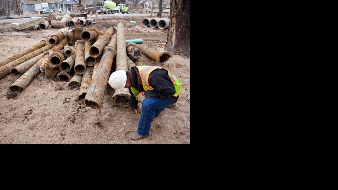 
Duane Boutz of Dondlinger & Sons Construction Co. inspects a leaded joint in an old and corroded water line along 13th Street. Increases in water and sewer rates will help pay for repair or replacement of old lines. (Feb 7, 2013)
