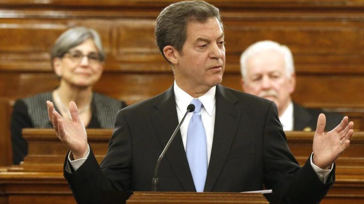 Gov. Sam Brownback addresses a joint session of the Kansas House and Senate during the annual State of the State speech in 2016. Some lawmakers are calling on him to lay out his vision for fixing the budget gap in his 2017 speech. (Jan. 12, 2016)