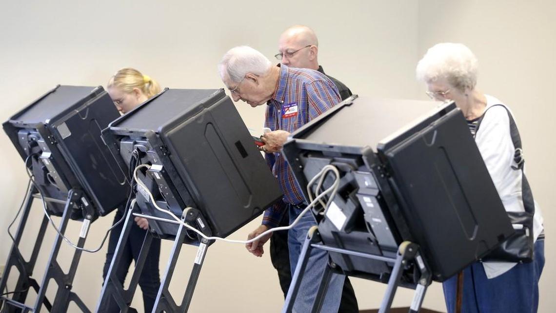 Voters cast their ballots in 2014 during advance voting at Grace Presbyterian Church. (Oct. 29, 2014)