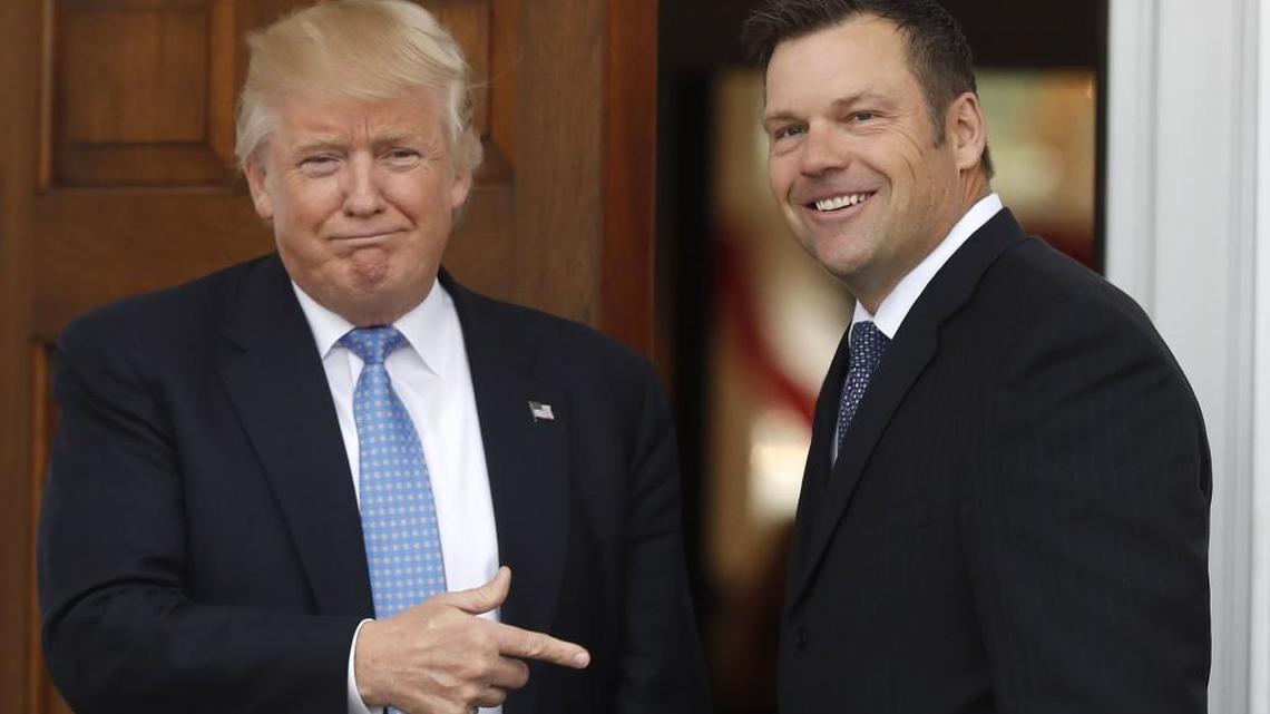 Then-President-elect Donald Trump greets Kansas Secretary of State Kris Kobach as he arrive in Bedminster, N.J. last November.