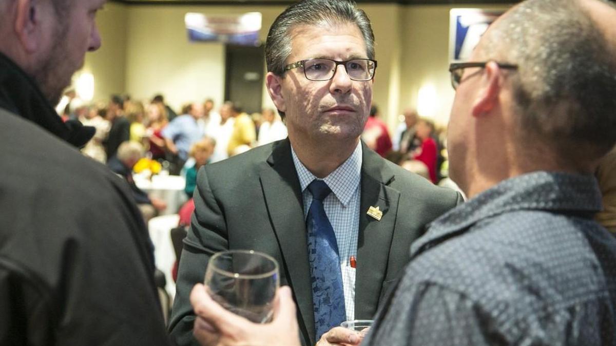 State Rep. Jim Howell talks with supporters at a Sedgwick County Republican Party election watch party in 2014. Howell, now a Sedgwick County commissioner, plans to testify before lawmakers against a bill that would provide an exemption to a campus carry bill he backed as a legislator in 2015. (Nov. 4, 2014)