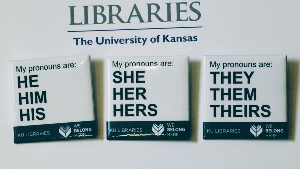 Buttons advertising part of the University of Kansas Libraries' "You Belong Here" campaign are displayed in Lawrence. The campaign is aimed at making undergraduates, including those who are transgender, feel welcome.